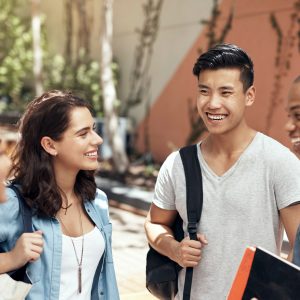 Two students smiling on campus